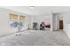 Expansive bonus room features exercise equipment and storage shelves, offering a versatile space at 951 Brookstone Dr, Franklin, IN 46131