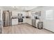 Bright kitchen with white cabinets, stainless steel appliances, and ample counter space at 951 Brookstone Dr, Franklin, IN 46131