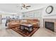 Comfortable living room with a fireplace, plush seating, and an open view to the kitchen at 951 Brookstone Dr, Franklin, IN 46131