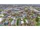 A bird's eye view of a neighborhood featuring a charming blue home with dual decks at 953 Harrison St, Indianapolis, IN 46202