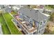 Aerial view of the backyard and deck with ample seating and an umbrella at 953 Harrison St, Indianapolis, IN 46202