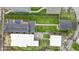 Aerial view of the property showcasing the house, deck, yard, and surrounding neighborhood at 953 Harrison St, Indianapolis, IN 46202