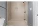 Bathroom with tub and shower featuring stylish tilework and modern fixtures at 953 Harrison St, Indianapolis, IN 46202