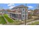 Charming two-story home features a spacious deck, fenced yard, and welcoming front porch, perfect for relaxing outdoors at 953 Harrison St, Indianapolis, IN 46202