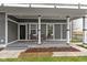 Cozy front porch with seating area, pillars, and stone accents at 953 Harrison St, Indianapolis, IN 46202