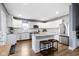 Bright, open kitchen with stainless steel appliances, granite countertops, and center island at 953 Harrison St, Indianapolis, IN 46202