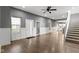 Spacious living room featuring stairs, modern flooring, and an open layout at 953 Harrison St, Indianapolis, IN 46202