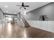 Open-concept living room with stairs, modern flooring, and open access to the kitchen at 953 Harrison St, Indianapolis, IN 46202