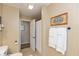 Bathroom with a shower and a toilet with a framed sign on the wall and towel rack with towels at 1002 Corey Ln, Plainfield, IN 46168
