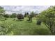 Large grassy backyard features mature trees and lush landscaping at 1021 Hudson Bay Dr, Greenwood, IN 46142