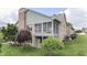 Charming backyard featuring a screened-in porch and well-maintained lawn at 1021 Hudson Bay Dr, Greenwood, IN 46142