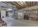 Unfinished basement with exposed ceiling, shelving, and utility connections at 1021 Hudson Bay Dr, Greenwood, IN 46142