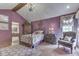Stylish bedroom with vintage-inspired decor, ensuite bathroom, and natural light at 1021 Hudson Bay Dr, Greenwood, IN 46142