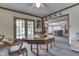 Relaxed dining room with outdoor access and open view to the living room at 1021 Hudson Bay Dr, Greenwood, IN 46142