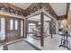 Elegant dining room with floral wallpaper, wood trim, and stylish furnishings at 1021 Hudson Bay Dr, Greenwood, IN 46142