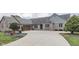 Charming brick home with a spacious driveway and a well-manicured front yard at 1021 Hudson Bay Dr, Greenwood, IN 46142
