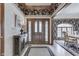 Inviting foyer leads to an elegant dining room, with decorative floors and beautiful wood accents at 1021 Hudson Bay Dr, Greenwood, IN 46142