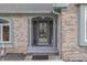 Charming front entrance with brick facade, covered porch, and tiled steps at 1021 Hudson Bay Dr, Greenwood, IN 46142
