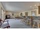 Large carpeted game room with pool table, bar seating, and jukebox at 1021 Hudson Bay Dr, Greenwood, IN 46142