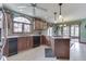 Well-designed kitchen with wooden cabinets, tiled floors, modern appliances, and an adjacent breakfast nook, perfect for casual meals at 1021 Hudson Bay Dr, Greenwood, IN 46142