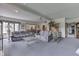 Spacious living room with a neutral carpet, ceiling fan, and large windows at 1021 Hudson Bay Dr, Greenwood, IN 46142