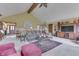 Spacious living room featuring vaulted ceilings, large windows, and a decorative fireplace, creating a comfortable living space at 1021 Hudson Bay Dr, Greenwood, IN 46142