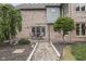 A patio features a stone pathway, outdoor seating, and a brick exterior at 1021 Hudson Bay Dr, Greenwood, IN 46142