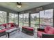Bright and airy sunroom with comfortable seating and scenic views of the outdoors at 1021 Hudson Bay Dr, Greenwood, IN 46142