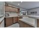 Home wet bar area featuring wooden cabinets, countertop space and glassware storage at 1021 Hudson Bay Dr, Greenwood, IN 46142