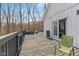 View of the expansive back deck with seating and access to the bedroom through elegant French doors at 1037 E Woodall Ct, Martinsville, IN 46151