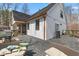 Relax on the spacious back deck with comfortable seating and easy access to the screened-in porch at 1037 E Woodall Ct, Martinsville, IN 46151