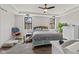 Spacious bedroom with a cozy sitting area, large windows, and a comfortable queen-size bed at 1037 E Woodall Ct, Martinsville, IN 46151