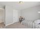 Bedroom featuring a bed, a desk, and a window overlooking the outdoors at 1037 E Woodall Ct, Martinsville, IN 46151