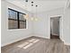 Well-lit dining room with modern starburst lighting and large window at 1037 E Woodall Ct, Martinsville, IN 46151