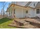 Exterior view with a covered porch, manicured landscaping and a green lawn at 1037 E Woodall Ct, Martinsville, IN 46151