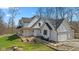 Beautifully designed home with a wrap-around porch and manicured landscaping for great curb appeal at 1037 E Woodall Ct, Martinsville, IN 46151