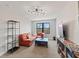 Cozy living room with a red sofa, unique lighting, and a large window with natural light at 1037 E Woodall Ct, Martinsville, IN 46151