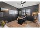 Stylish home office with dark walls, a modern desk, and a large window at 1037 E Woodall Ct, Martinsville, IN 46151