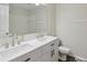 Well-lit bathroom features a double sink vanity with white cabinets and modern fixtures at 11117 Harriston Dr, Fishers, IN 46037