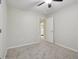 Bedroom featuring neutral carpet, ceiling fan, and an open doorway leading to bathroom at 11117 Harriston Dr, Fishers, IN 46037