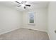 Neutral toned bedroom with soft carpet, a window with blinds, and ceiling fan at 11117 Harriston Dr, Fishers, IN 46037