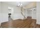 Open-concept living room with hardwood flooring, fresh paint, and modern trim work throughout the house at 11117 Harriston Dr, Fishers, IN 46037