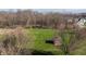 Aerial view showcasing the expansive green yard, with a red shed and firepit at 11124 Deer Valley Dr, Indianapolis, IN 46229