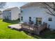 A well-maintained back deck with a grill, table and chairs, perfect for outdoor entertaining at 11124 Deer Valley Dr, Indianapolis, IN 46229