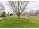 Green backyard with a shed and mature trees at 11124 Deer Valley Dr, Indianapolis, IN 46229