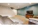 Cozy finished basement area with carpeting, a TV, and stairway access at 11124 Deer Valley Dr, Indianapolis, IN 46229