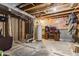 Unfinished basement with exposed ductwork, water heater, and basic furnishings at 11124 Deer Valley Dr, Indianapolis, IN 46229