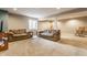 Finished basement area featuring neutral carpeting, two couches, and a window for natural light at 11124 Deer Valley Dr, Indianapolis, IN 46229