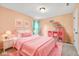 Pink themed bedroom featuring a twin bed, nightstand and shelves at 11124 Deer Valley Dr, Indianapolis, IN 46229