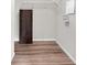 Walk-in closet featuring hardwood floors, white shelving, and a white trim at 11124 Deer Valley Dr, Indianapolis, IN 46229